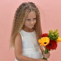 girl with long hair holds a bouquet of flowers Royalty Free Stock Photo