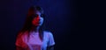 The girl with long hair and neon lights. Trend neon light. The concept of the psychological problems of the teenager Royalty Free Stock Photo