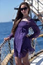 Girl with long hair in a purple dress Royalty Free Stock Photo