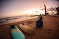 Girl with long hair sitting on a beach Royalty Free Stock Photo