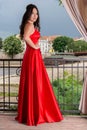 Elegance and Achievement: High School Graduate Posing on Garden Balcony Royalty Free Stock Photo