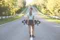 Girl with longboard.