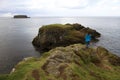 A girl look the coastal scenery near Carrick a Rede