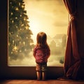 girl look out the window. christmas tree outside. Waiting for gifts and miracle