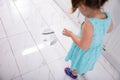 Girl Looking At Broken White Plate