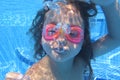 Girl looking at camera underwater