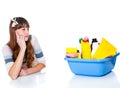 Girl looking at chemical detergents Royalty Free Stock Photo