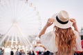 Girl is looking at the Ferris wheel. Ukraine, cotract area