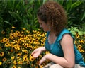 Girl Looking at Flowers