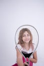 Girl looking happy with tennis racket Royalty Free Stock Photo