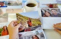 Girl looking at her printed photos, remember nostalgia for a day of rest Royalty Free Stock Photo