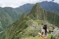 Girl looking at Machu Picchu.