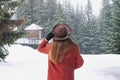 Girl looking on mountain view wearing hat