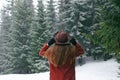 Girl looking on mountain view wearing hat