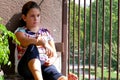 Girl looking out the balcony Royalty Free Stock Photo