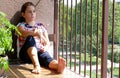 Girl looking out the balcony Royalty Free Stock Photo