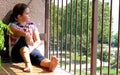 Girl looking out the balcony Royalty Free Stock Photo