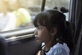 Girl looking out of the car window wearily due to traffic jams. Royalty Free Stock Photo