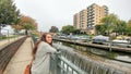 Girl looking out at Geneva Towers Condominium With Boats Docked by Pier