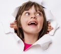 Girl looking out of a hole in a paper Royalty Free Stock Photo