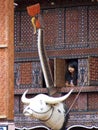 Girl looking out of window from tongkonan