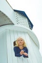 Girl looking out the window of the tower