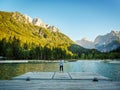 Girl looking over Kranjska Gora lake into the mountains, Slovenia