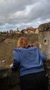 Girl looking over a wall in Rothenburg, Germany Royalty Free Stock Photo