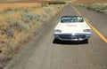 Girl looking in rear view mirror of Thunderbird Co Royalty Free Stock Photo