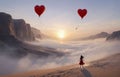 girl looking at red hot air balloons. Balloons in shape of heart flying in the sunset sky. Wedding, Valentine, love concept. Royalty Free Stock Photo