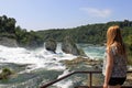 Girl looking at the Rhine Falls in Switzerland