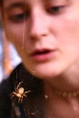 Girl looking at spider web