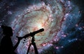 Girl looking at the stars with telescope. Messier 83 Royalty Free Stock Photo