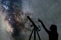 Girl looking at the stars. Telescope Milky Way Royalty Free Stock Photo