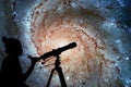 Girl looking at the stars with telescope. Pinwheel Galaxy Royalty Free Stock Photo
