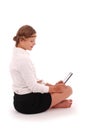 Girl looking at tablet pc while sitting