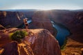 Girl looking to Horseshoe Bend and Colorado river. Arizona Horseshoe Bend in Grand Canyon. Travel and adventure concept. Royalty Free Stock Photo