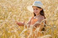 Girl looking of wheat's spica Royalty Free Stock Photo