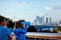 Girl looks through binoculars at Moscow