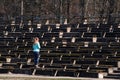 Girl looks at broken stadium benches