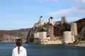 The girl looks at the Golubac fortress on Danube river Royalty Free Stock Photo