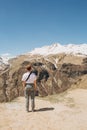 Girl looks mountains Caucasus snow glaciers top Royalty Free Stock Photo