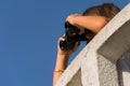 Girl with binoculars on the lookout