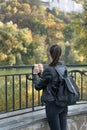 Girl looks at the park. Young beautiful woman resting outdoor. Back view Royalty Free Stock Photo