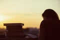 Girl with a lot of books on sunset background. Preparation for university exams. education concept Royalty Free Stock Photo