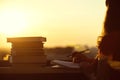 Girl with a lot of books on sunset background. Preparation for university exams. education concept Royalty Free Stock Photo