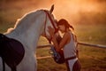 Girl love hourse. Woman and her horse on a sunset