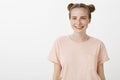 Girl loves life and friends. Optimistic carefree feminine woman in pink t-shirt with freckles and cute blue eyes