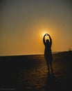 A girl is loving Darius nature over the ocean at sunset in Digha allure West Bengal