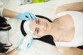 Girl lying in beauty spa enjoying skin therapy using current treatment Royalty Free Stock Photo